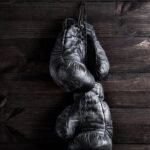 Old black leather boxing gloves