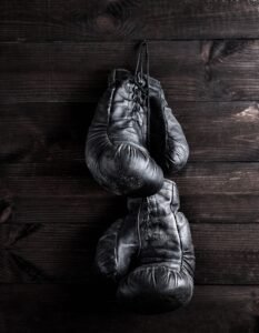 Old black leather boxing gloves